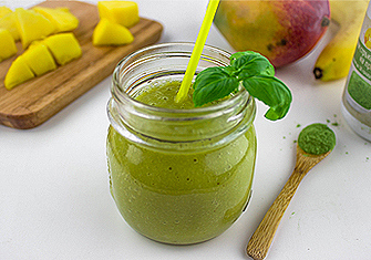 Smoothie From Mango, Banana and Oat Grass